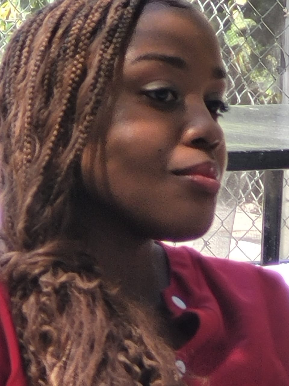 Portrait of an EXL teacher with braided hair