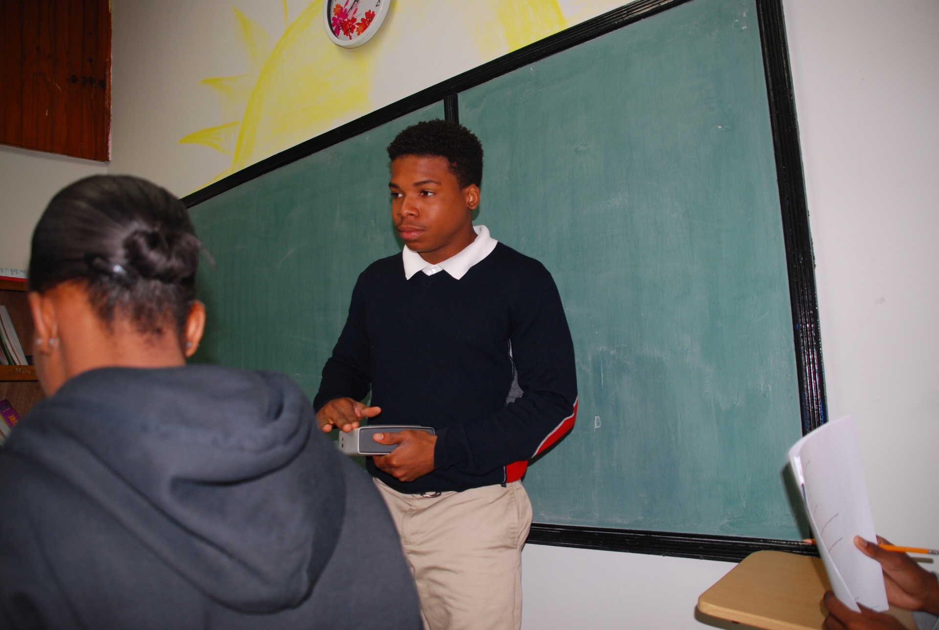 EXL student presenting at the chalkboard