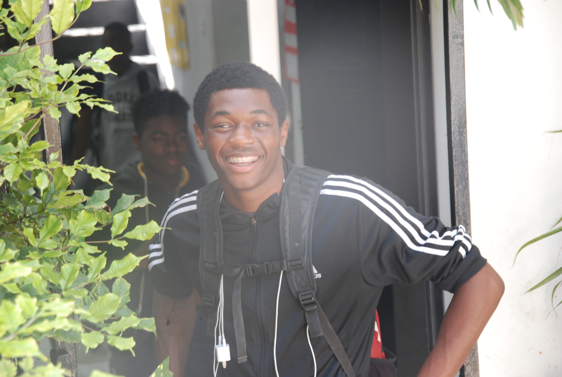 Smiling EXL high school student with backpack