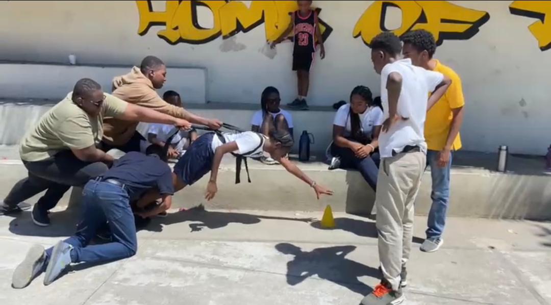 EXL students during a PE class activity outdoors