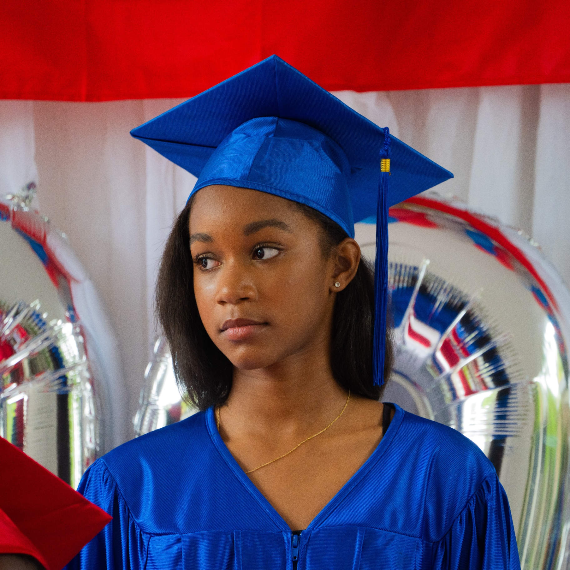 Graduate in blue cap and gown